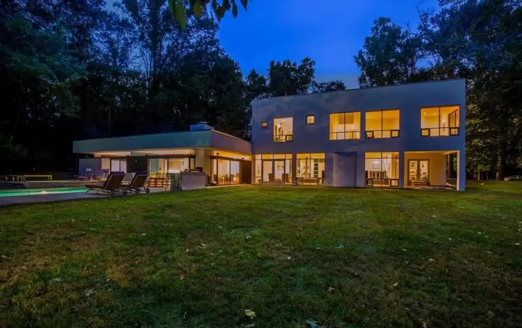 Contemporary Rockville, Maryland home at dusk from the rear lawn